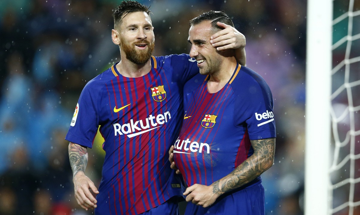 FC Barcelona's Paco Alcacer, right, celebrates after scoring with his teammate Lionel Messi during the Spanish La Liga soccer match between FC Barcelona and Sevilla at the Camp Nou stadium in Bar ...