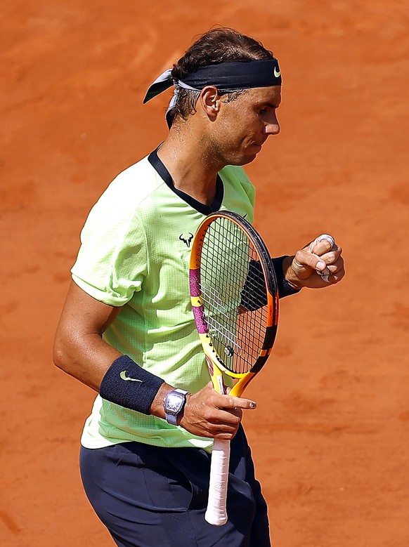 epa09257535 Rafael Nadal of Spain reacts during his quarter final match against Diego Schwartzman of Argentina at the French Open tennis tournament at Roland Garros in Paris, France, 09 June 2021. EPA ...