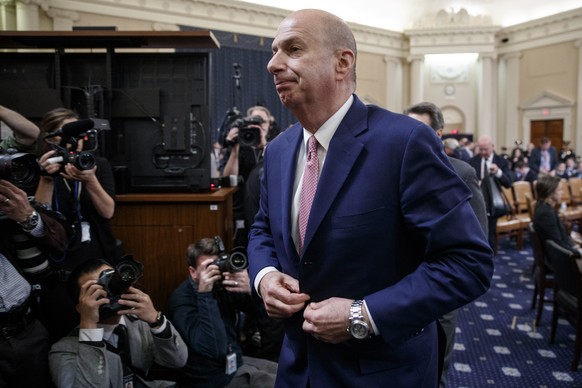 epa08012578 US Ambassador to the European Union Gordon Sondland departs from the hearing room, following his testimony before the House Permanent Select Committee on Intelligence public hearing on the ...