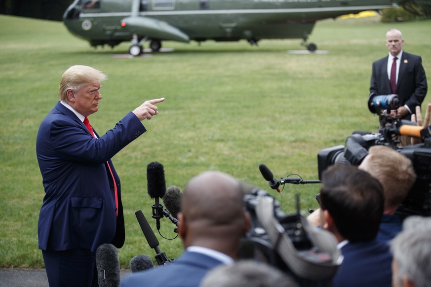 epa07892183 US President Donald J. Trump responds to a question from the news media as he walks to board Marine One on the South Lawn of the White House in Washington, DC, USA, 03 October 2019. Presid ...