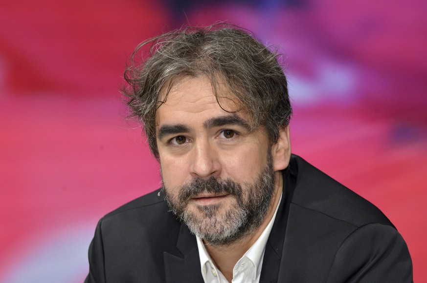 FILE - In this July 21, 2016 file photo German-Turkish journalist Deniz Yucel is pictured during a talkshow in Berlin, Germany. Yucel was imprisoned in Turkey on espionage charges on Feb. 14, 2017. (K ...