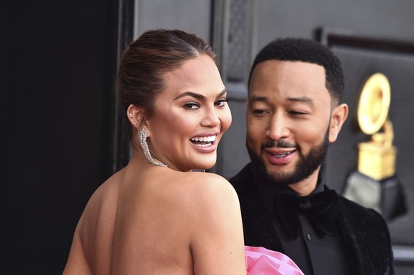 Chrissy Teigen, left, and John Legend arrive at the 64th Annual Grammy Awards at the MGM Grand Garden Arena on Sunday, April 3, 2022, in Las Vegas. (Photo by Jordan Strauss/Invision/AP)
Chrissy Teigen ...