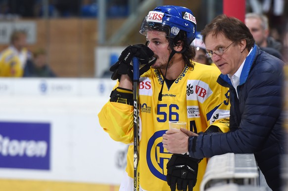 Davos Dino Wieser and coach Arno del Curto disappointment after losing the game between Switzerlands HC Lugano and Switzerlands HC Davos at the 90th Spengler Cup ice hockey tournament in Davos, Switze ...