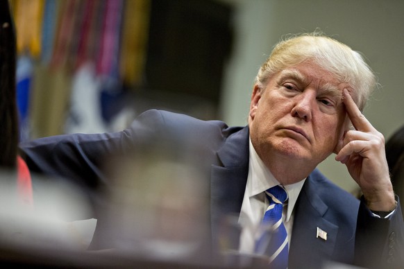 epa05874011 US President Donald Trump listens while meeting with women small business owners in the Roosevelt Room of the White House in Washington, DC, USA, 27 March 2017. Investors further unwound t ...