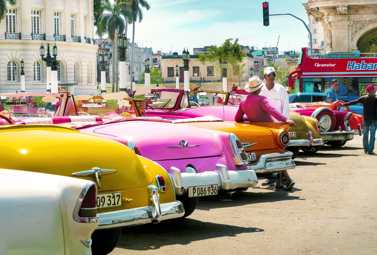 Cuba, Havana - 07 April, 2016: beautiful colorful retro cars of American production turned into exotic taxis in the capital of Cuba, Havana, waiting for tourists to show around the city