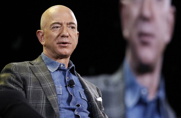 FILE - In this June 6, 2019, file photo Amazon CEO Jeff Bezos speaks at the the Amazon re:MARS convention in Las Vegas. The price to rocket into space next month with Bezos and his brother is a cool $ ...