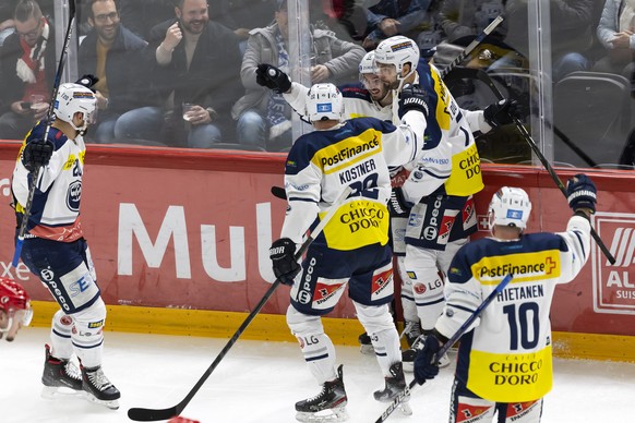 Ambri-Piotta&#039;s forward Noele Trisconi, center, celebrates his goal with his teammates after scoring the 0:1, during the third leg of the National League pre playoff game of the Swiss Championship ...