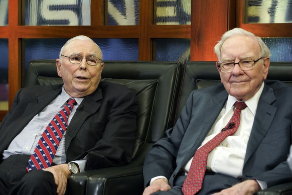 FILE - Berkshire Hathaway Chairman and CEO Warren Buffett, right, and his Vice Chairman Charlie Munger, left, speak during an interview in Omaha, Neb., Monday, May 7, 2018, with Liz Claman on Fox Busi ...