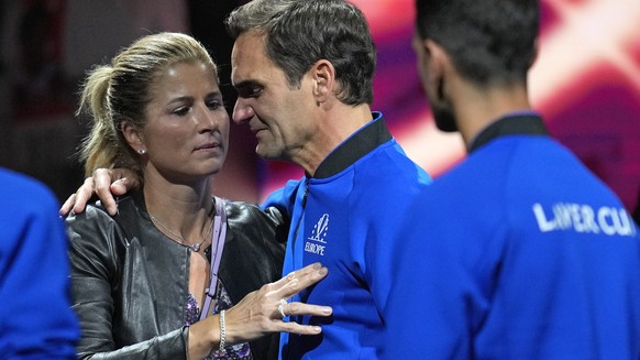 An emotional Roger Federer of Team Europe is embraced by his wife Mirka after playing with Rafael Nadal in a Laver Cup doubles match against Team World's Jack Sock and Frances Tiafoe at the O2 arena i ...