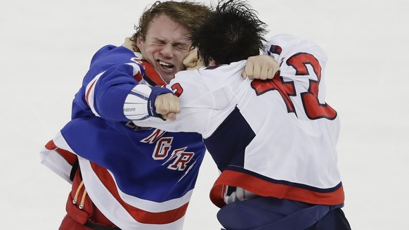 New York Rangers&#039; Brendan Lemieux, left, is punched by Washington Capitals&#039; Tom Wilson (43) during the third period of an NHL hockey game Wednesday, Nov. 20, 2019, in New York. The Rangers w ...