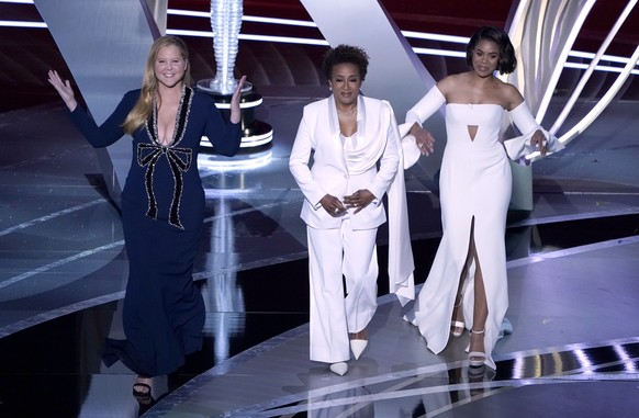 Hosts Amy Schumer, from left, Wanda Sykes, and Regina Hall appear on stage at the Oscars on Sunday, March 27, 2022, at the Dolby Theatre in Los Angeles. (AP Photo/Chris Pizzello)
Amy Schumer,Wanda Syk ...