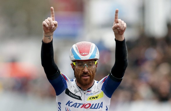 Katusha team rider Lucas Paolini of Italy celebrates winning the Gent-Wevelgem classic cycling race in Wevelgem March 29, 2015. Italian veteran Paolini outwitted a select group of favourites to win th ...