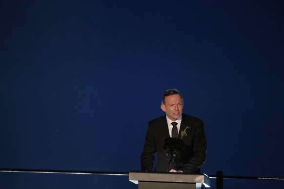 Australia's Prime Minister Tony Abbot talks during the Dawn Service ceremony at the Anzac Cove beach in Gallipoli peninsula, Turkey, early Saturday, April 25, 2015. Anzac Cove is a small cove on the G ...