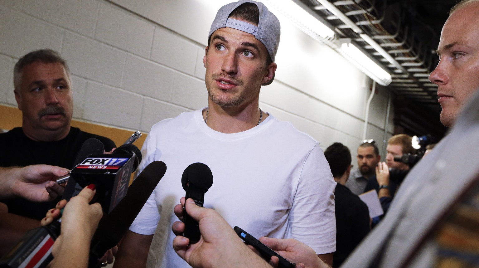 Nashville Predators defenseman Roman Josi, of Switzerland, talks with reporters as players report for NHL hockey training camp Thursday, Sept. 17, 2015, in Nashville, Tenn. The Predators will be on th ...