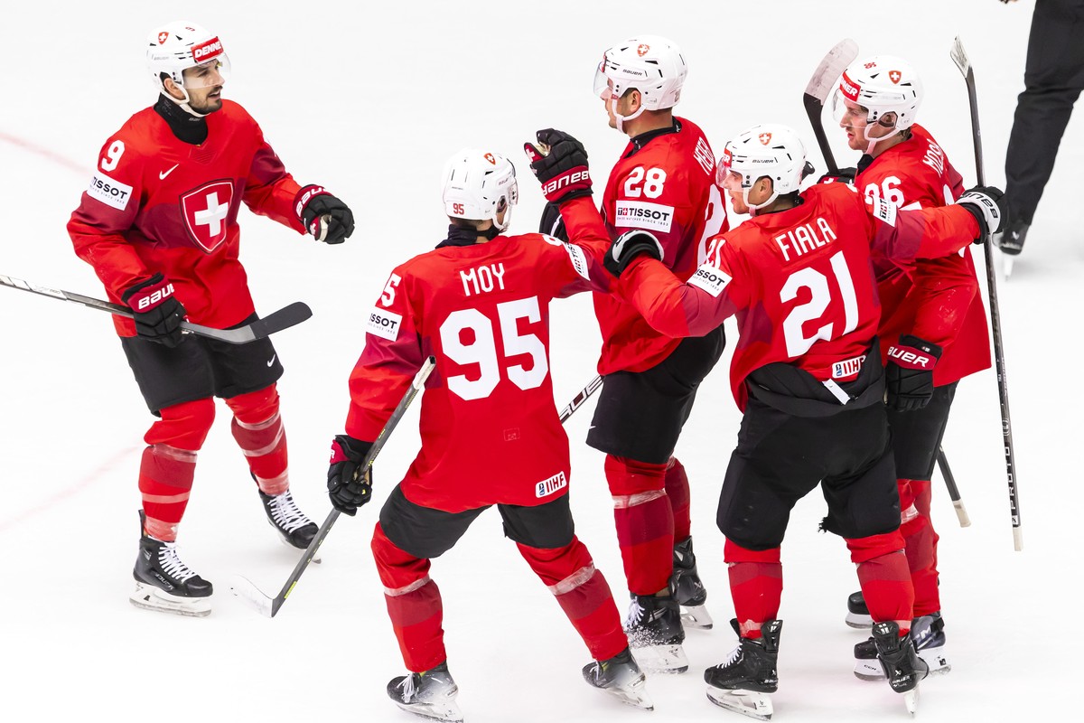 epa12125944 Switzerland's forward Timo Meier #28 celebrates his goal with his teammates Switzerland's forward Damien Riat #9, Switzerland's forward Tyler Moy #95 Switzerland's forw ...