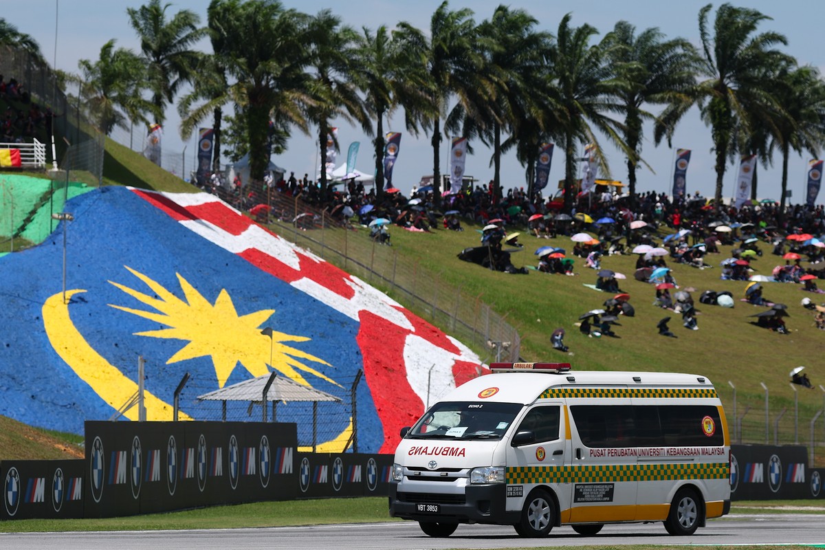 epa12483193 An ambulance is seen after crash involves Spanish Moto3 Rider Jose Antonio Rueda of Red Bull KTM Ajo and Swiss Moto3 rider Noah Dettwiler of CIP Green Power at the Malaysia Motorcycling Gr ...