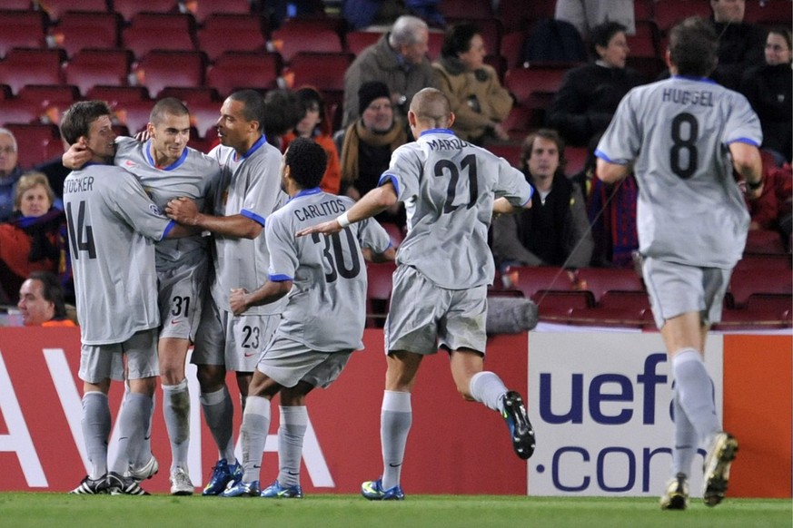 Basel&#039;s players cheer with Eren Derdiyok, second from left, after he scored during the Champions League group C soccer match between Spain&#039;s FC Barcelona and Switzerland&#039;s FC Basel at t ...