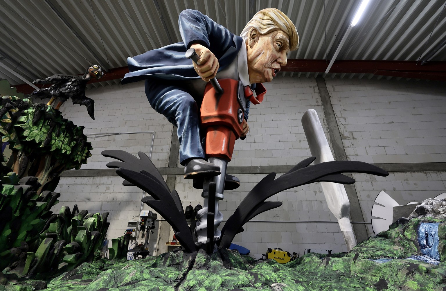 epa11923121 A carnival float titled &#039;Drill baby drill&#039; depicting the US President Donald Trump is presented by the Mainz Carnival Association during a media preview in Mainz, Germany, 25 Feb ...