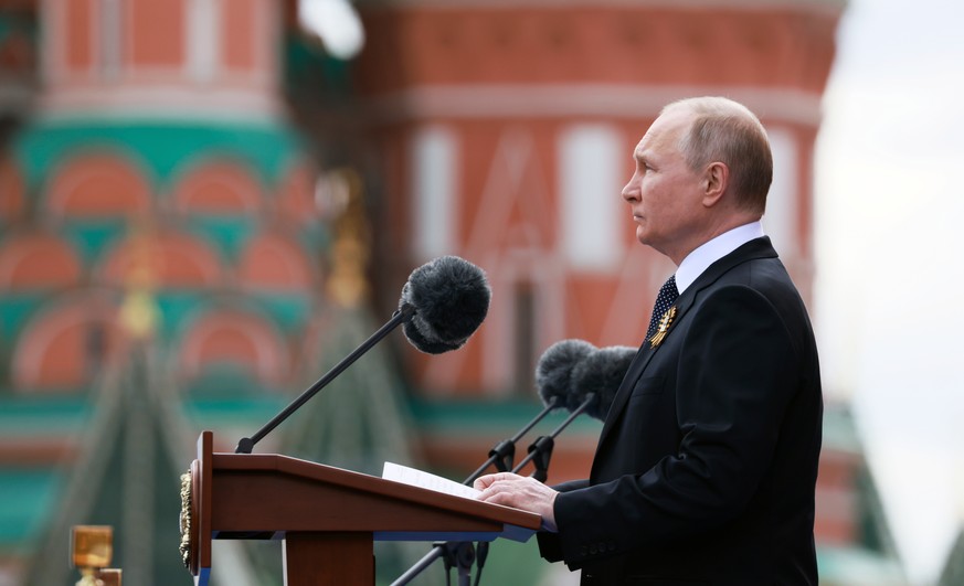 epa09935229 Russian President Vladimir Putin delivers a speech during the Victory Day military parade in the Red Square in Moscow, Russia, 09 May 2022. The Victory Day military parade takes place annu ...