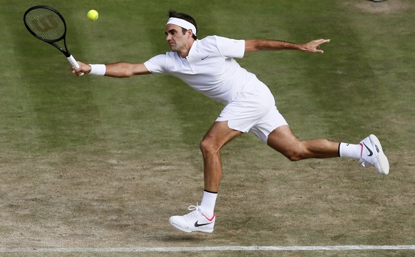 Switzerland&#039;s Roger Federer reaches for a shot from Germany&#039;s Mischa Zverev during their Men&#039;s Singles Match on day six at the Wimbledon Tennis Championships in London Saturday, July 8, ...