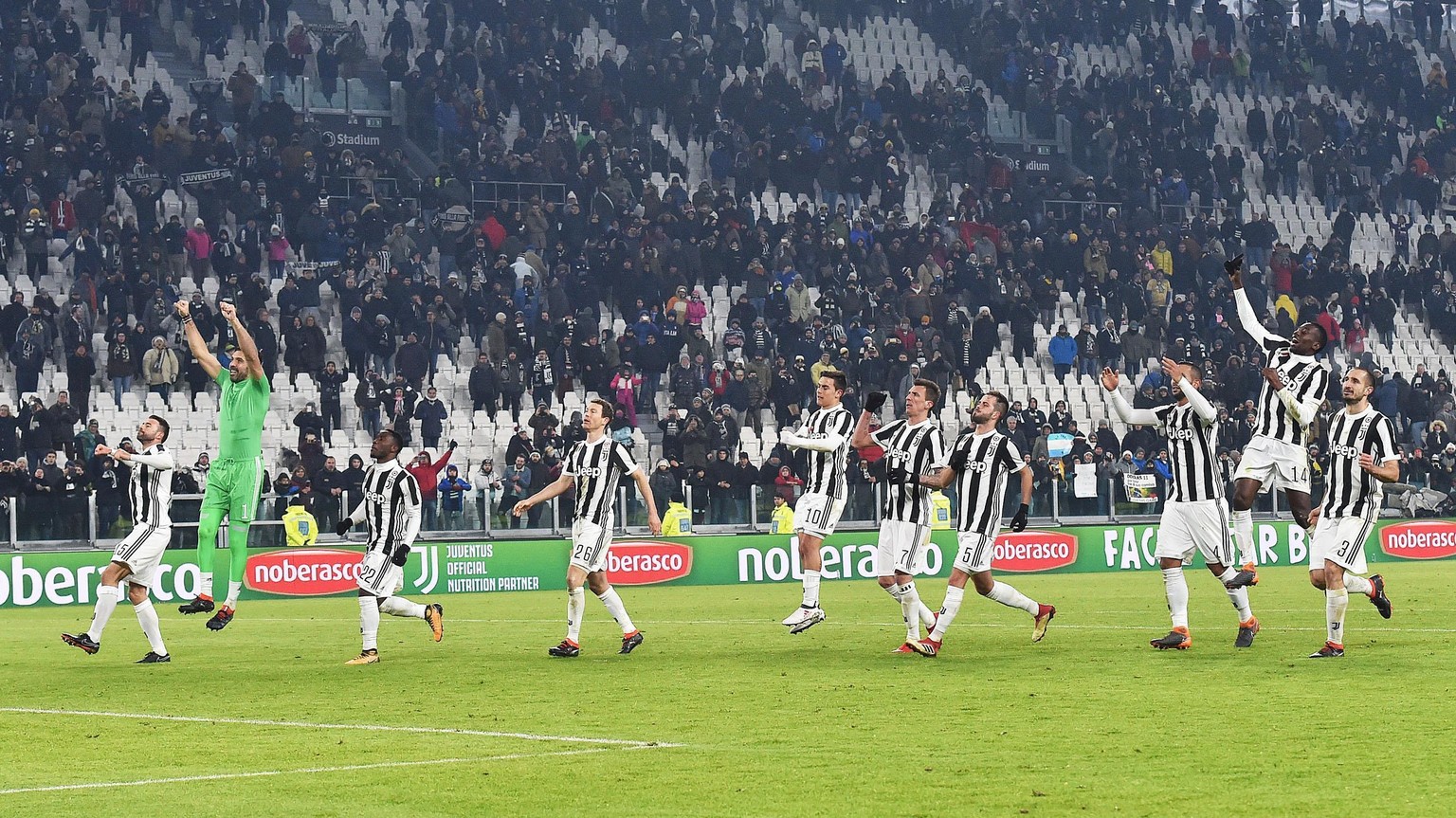 Juventus players celebrate their 1-0 win at the end of the Italian Cup semifinal second-leg soccer match between Juventus and Atalanta, at the Allianz Stadium in Turin, Italy, Wednesday, Feb. 28, 2018 ...