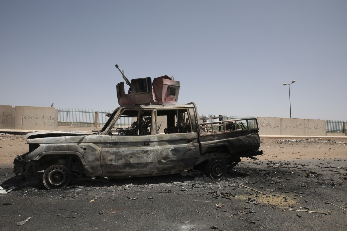 A destroyed military vehicle is seen in southern in Khartoum, Sudan, Thursday, April 20, 2023. The latest attempt at a cease-fire between the rival Sudanese forces faltered as gunfire rattled the capi ...