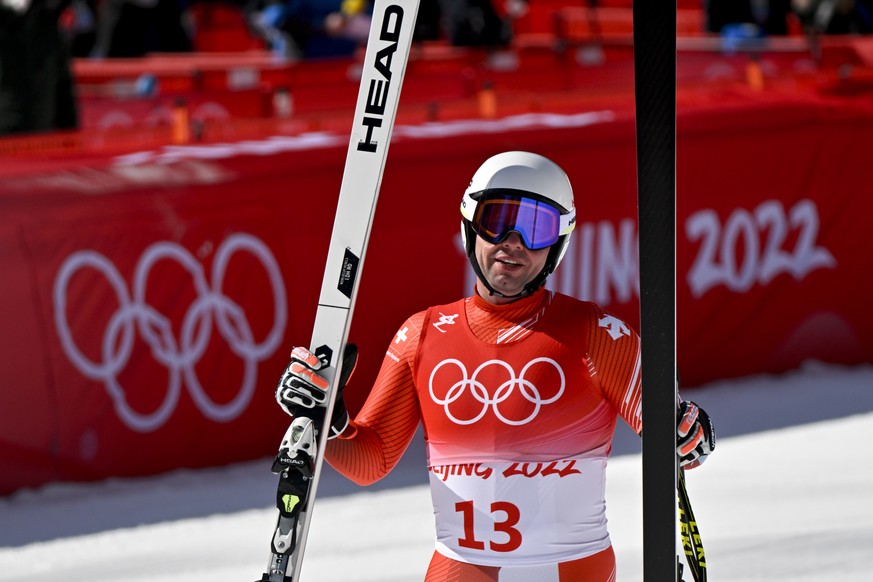 epa09734409 Beat Feuz of Switzerland reacts after his run in the Men&#039;s Downhill race of the Alpine Skiing events of the Beijing 2022 Olympic Games at the Yanqing National Alpine Ski Centre Skiing ...