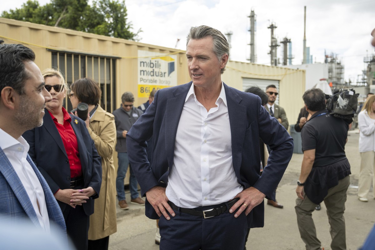 California Gov. Gavin Newsom loks at alternative fuel trucks at World Energy Paramount in Paramount, Calif., Monday, May 1, 2023. (Hans Gutknecht/The Orange County Register via AP)