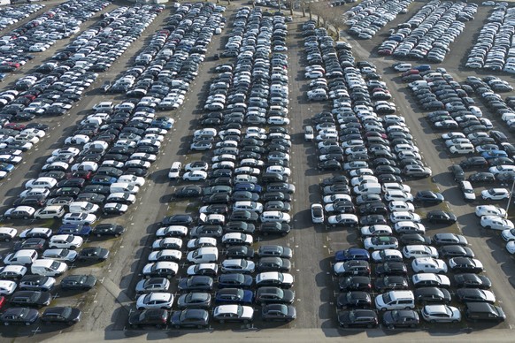 New German cars are stored at a logistic center in Essen, Germany, Monday, Feb. 3, 2025, as US President Trump threatens the European Union (EU) with new tariffs. (AP Photo/Martin Meissner)