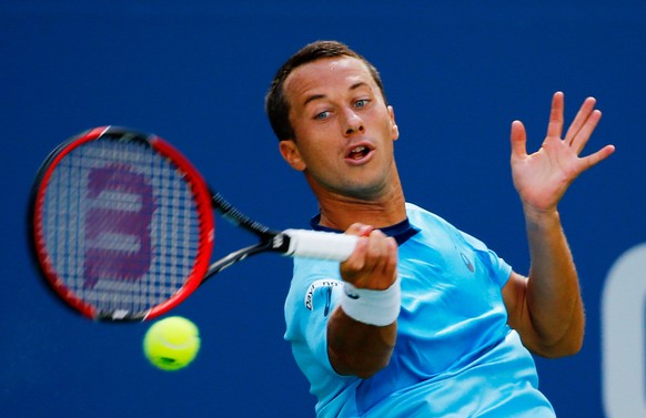 NEW YORK, NY - SEPTEMBER 05: Philipp Kohlschreiber of Germany returns a shot to Roger Federer of Switzerland during their Men&#039;s Singles Third Round match on Day Six of the 2015 US Open at the UST ...