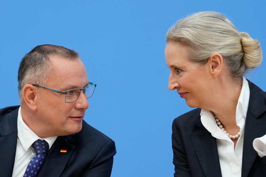 AfD party leaders Alice Weidel and Tino Chrupalla talk during a press conference of the "Alternative for Germany" (AfD) in Berlin, Germany, after yesterday's two state elections in Berl ...