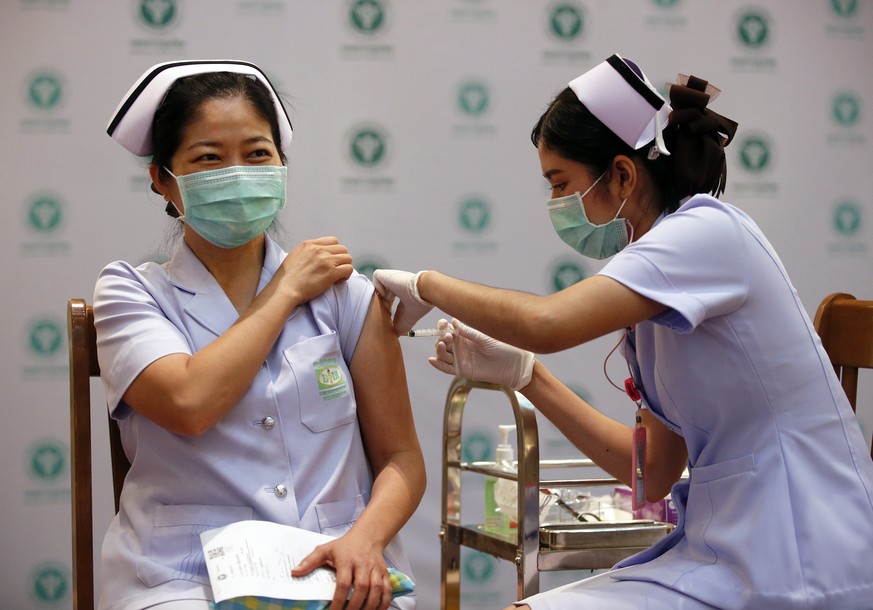 epa09041741 A Thai nurse receives a shot of CoronaVac COVID-19 vaccine developed by Sinovac as the national inoculation program for health workers and at-risk groups kicks off, at Bamrasnaradura Infec ...