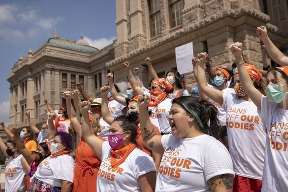 FILE - In this Sept. 1, 2021 file photo, women protest against the six-week abortion ban at the Capitol in Austin, Texas. Even before a strict abortion ban took effect in Texas this week, clinics in n ...
