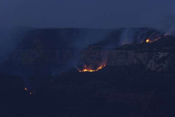 Smoke and fires rises at sunset from the Dragon Bravo fire at the Grand Canyon as seen from Mather Point near Grand Canyon Village, Ariz., Monday, July 28, 2025. (AP Photo/Jon Gambrell)
Grand Canyon F ...