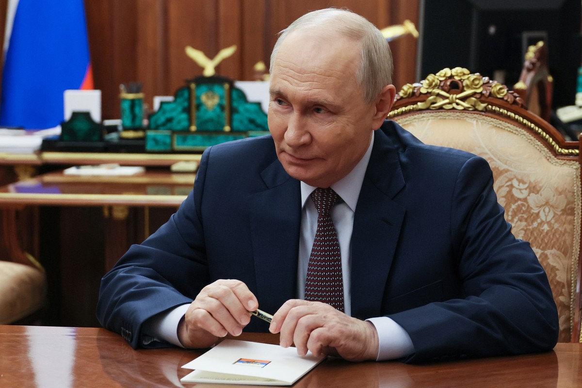 Russian President Vladimir Putin listens to Russian Prime Minister Mikhail Mishustin during their meeting at the Kremlin in Moscow, Monday, Oct. 19, 2026. (Mikhail Metzel/Sputnik, Kremlin Pool Photo v ...