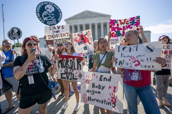 epa11428110 Anti-abortion activists protest at the Supreme Court in Washington, DC, USA, 21 June 2024. In an 8-1 decision, the Supreme Court upheld a federal law that prevents people who are subject t ...