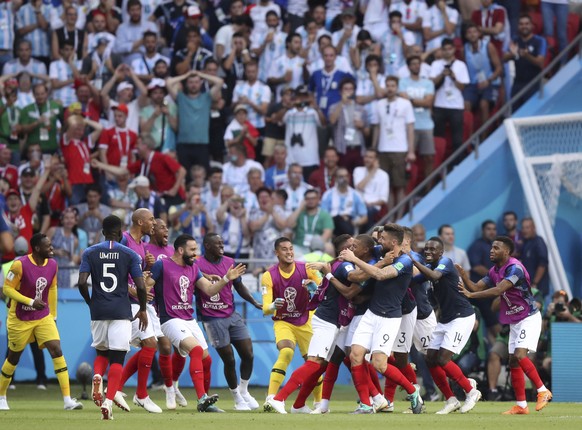 France players celebrate after Kylian Mbappe scores his side&#039;s fourth goal during the round of 16 match between France and Argentina, at the 2018 soccer World Cup at the Kazan Arena in Kazan, Rus ...