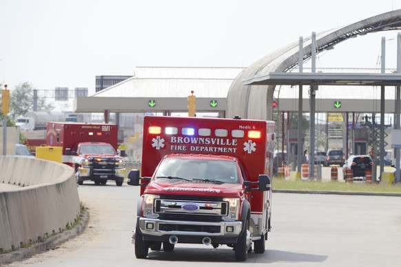 Brownsville Fire Department EMS Ambulances drive through Veterans International Bridge at Los Tomates with two surviving U.S. citizens being transported to Valley Regional Medical Center, Tuesday, Mar ...