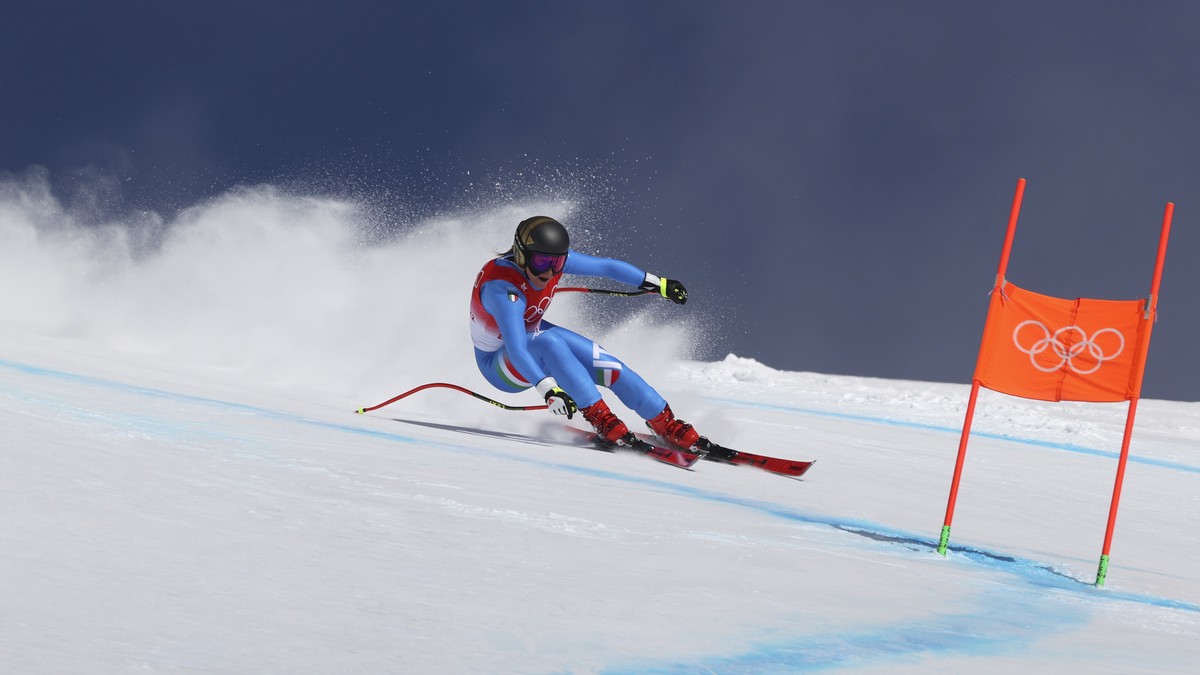 Sofia Goggia, of Italy makes a turn during the women's downhill at the 2022 Winter Olympics, Tuesday, Feb. 15, 2022, in the Yanqing district of Beijing. (AP Photo/Alessandro Trovati)