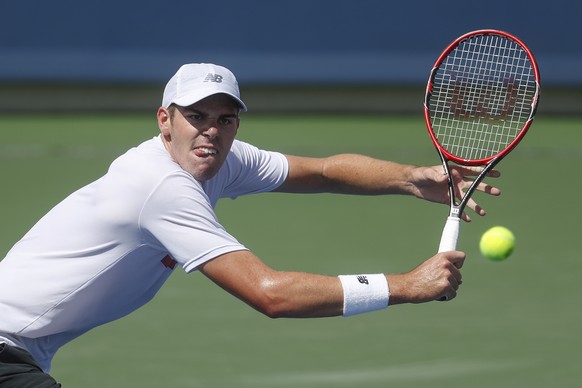 Reilly Opelka, of the United States, returns to Jo-Wilfred Tsonga, of France, on the fifth day of the Western &amp; Southern Open tennis tournament, Wednesday, Aug. 17, 2016, in Mason, Ohio. (AP Photo ...