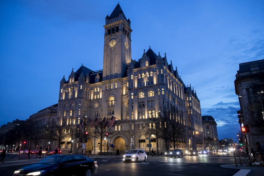 FILE - In this Jan. 23, 2019, file photo, the Trump International Hotel near sunset in Washington. A federal appeals court will reconsider a ruling from a three-judge panel that threw out a lawsuit ac ...