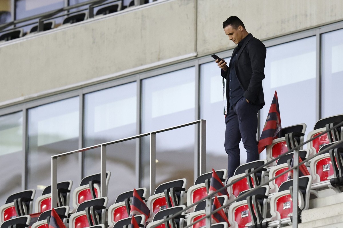 Basel's president David Degen uses his mobile phone on the tribune, prior to the UEFA Conference League quarter final soccer match between OGC Nice of France and Switzerland's FC Basel 1893, ...
