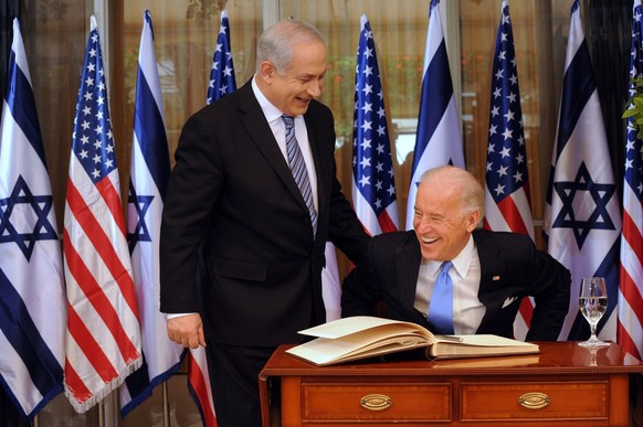 Israeli Prime Minister Benjamin Netanyahu, left, talks to US Vice President Joe Biden as Biden signs the guest book at the prime minister's residence in Jerusalem, Tuesday, March 9, 2010...