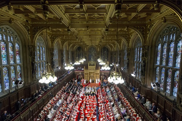 Members of the House of Lords gather to hear the Queen&#039;s Speech in the Chamber at the Houses of Parliament during the official State Opening of Parliament in London, Wednesday May 18, 2016. The S ...