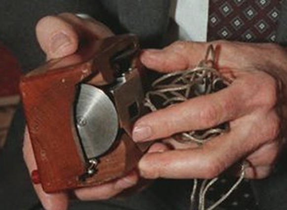 FILE - In this April 9, 1997 file photo, Doug Engelbart, inventor of the computer mouse and winner of the half-million dollar 1997 Lemelson-MIT prize, poses with the computer mouse he designed, in New ...