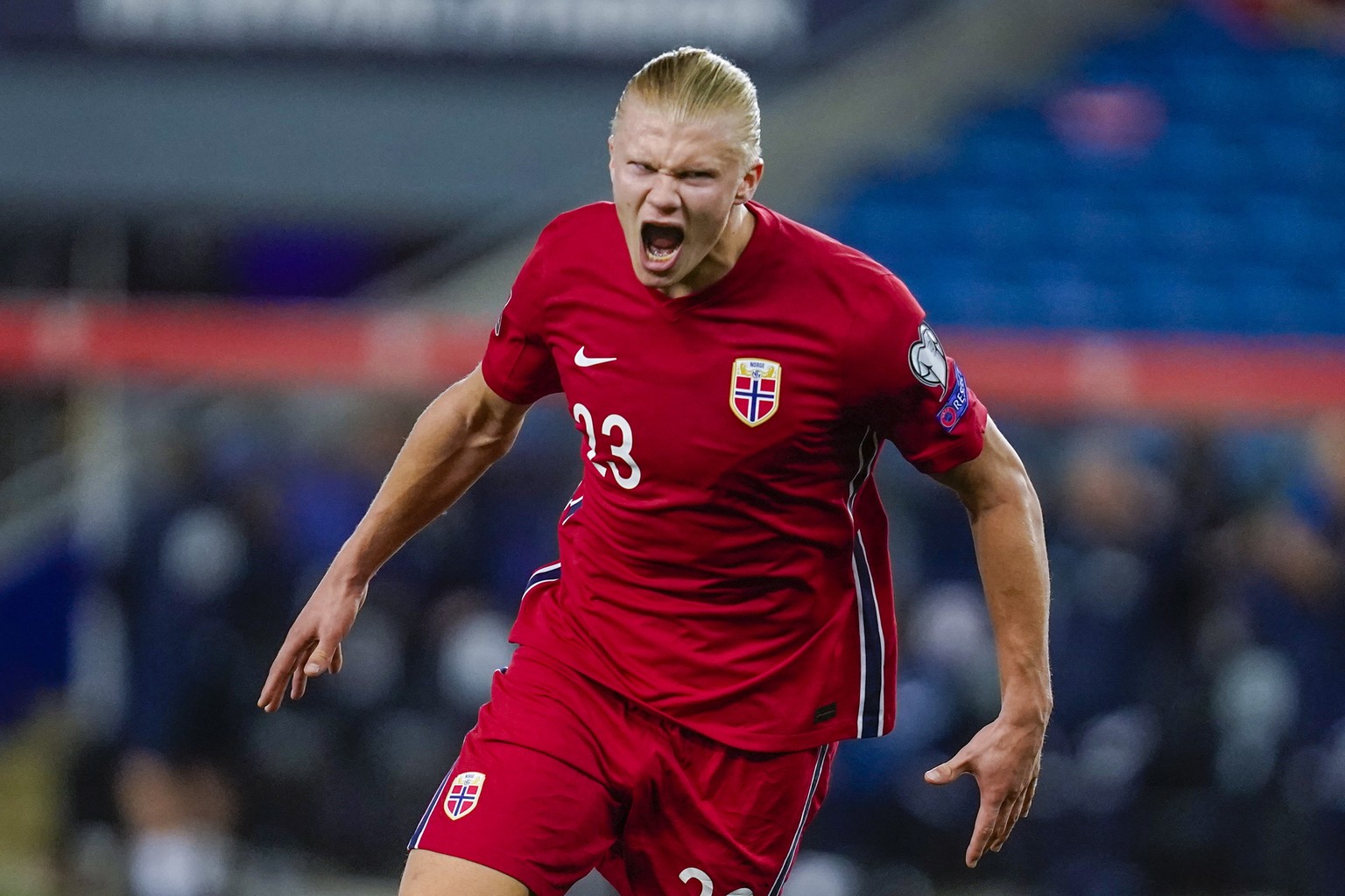 epa09454244 Erling Braut Haaland of Norway celebrates after scoring the 5-1 during the FIFA World Cup 2022 qualifier soccer match between Norway and Gibraltar at Ullevaal Stadium in Oslo, Norway, 07 S ...