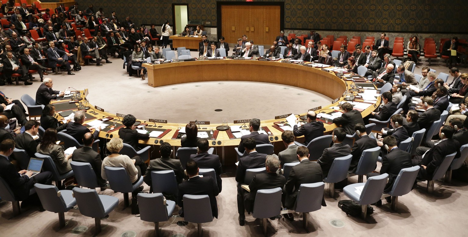 Members listen as Palestinian Ambassador to the United Nations Riyad Mansour, left, speaks during a meeting of the U.N. Security Council, Tuesday, Dec. 30, 2014, at the United Nations headquarters. Th ...
