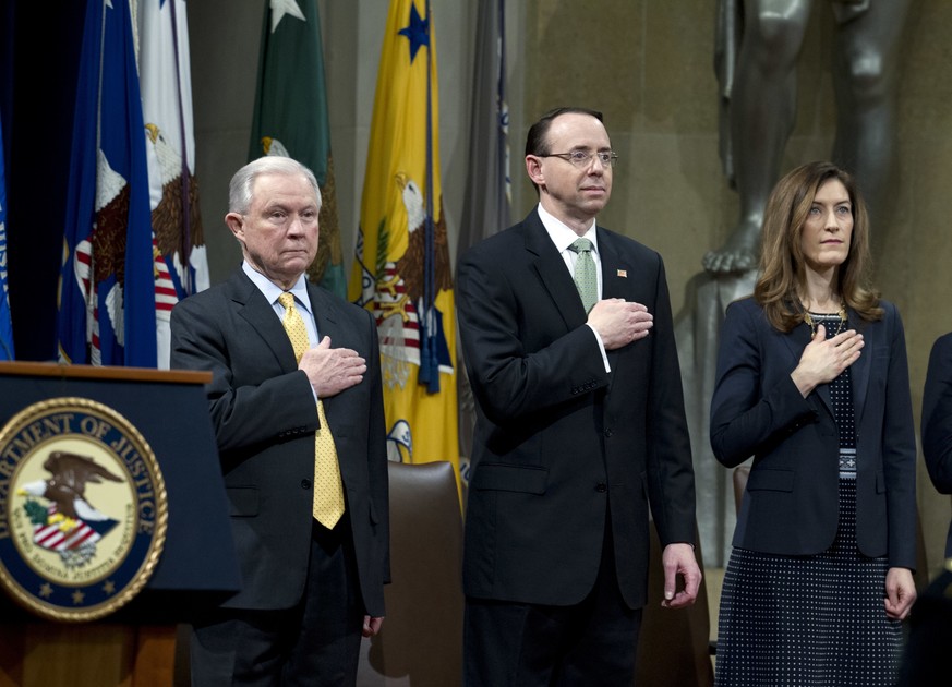 Attorney General Jeff Sessions accompanied by Deputy Attorney General Rod Rosenstein and Associate Attorney General Rachel Brand, listen the national anthem during the opening ceremony of the summit o ...