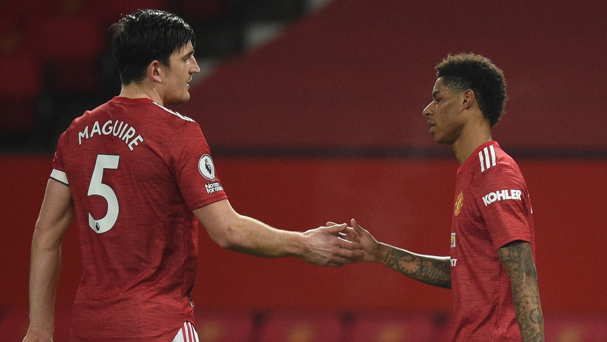 epa09028618 Manchester United's Marcus Rashford (R) celebrates with Harry Maguire (L) after scoring the 1-0 during the English Premier League soccer match between Manchester United and Newcastle  ...