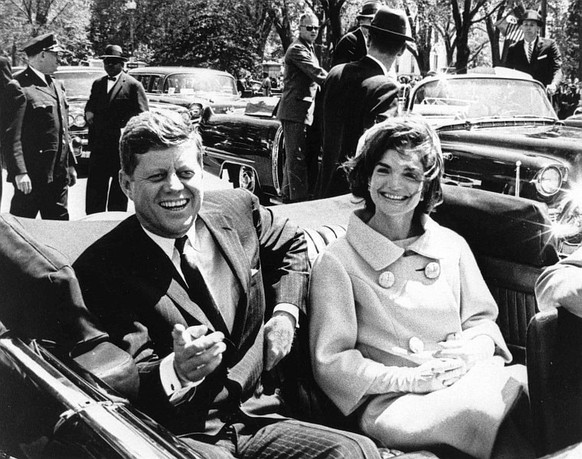 epa06291633 (FILE) - A handout photo made available by John F. Kennedy presidential Library shows US President John F. Kennedy (L) and First Lady Jacqueline Kennedy (R) following arrival ceremonies fo ...
